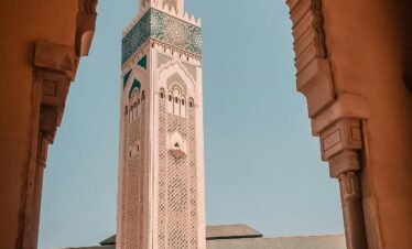 The grand Hassan II Mosque overlooking the Atlantic Ocean, a highlight of Morocco imperial cities tours