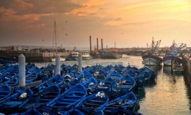 Traditional blue fishing boats at the port of Port of Essaouira during an Essaouira day trip on Morocco’s Atlantic coast.