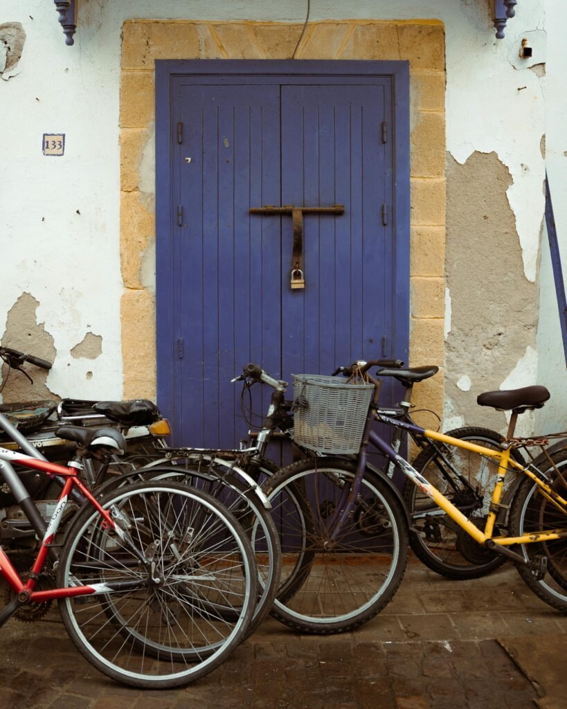 Colorful bicycles parked along the streets of Essaouira during a relaxing Essaouira day trip