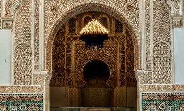 The intricate architecture of Ben Youssef Madrasa, a historic site on Morocco imperial cities tours