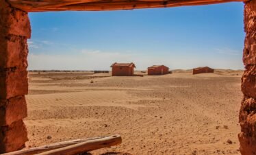 Desert camp among the golden dunes of the Sahara Desert during an adventure to Explore Fes and Atlas